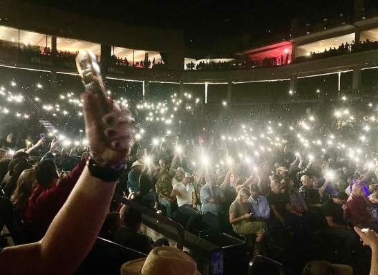 flashlights shine in a dark room