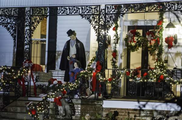 Mr. and Mrs Clause on front porch