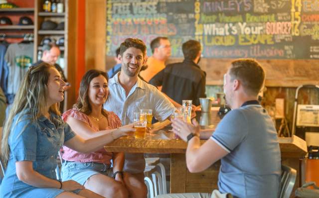 Group of young adults drinking at a brewery