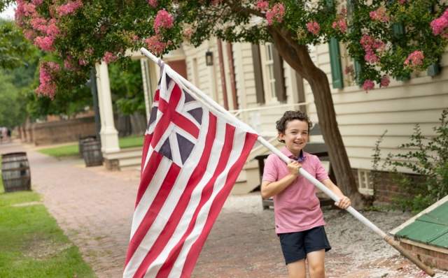 Child holding the Flag at Colonial Williamsburg