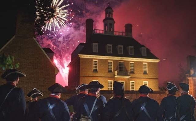Colonial soldiers watching fireworks go off on the 4th of July