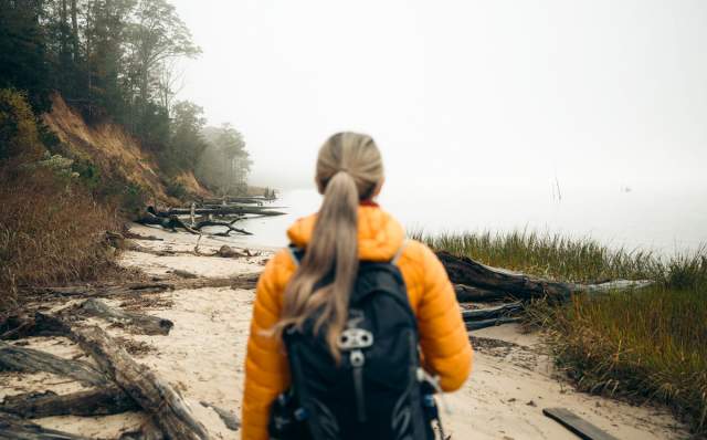 Woman hiking at York River State Park Fossil Beach