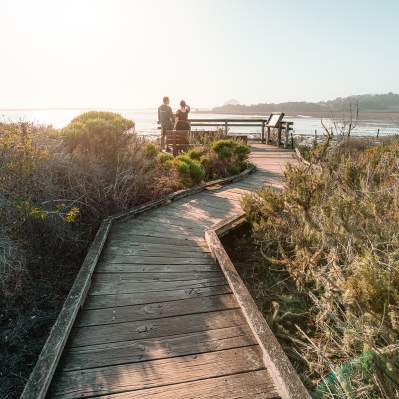 Couple walking on the Los Osos & Baywood Boardwalk