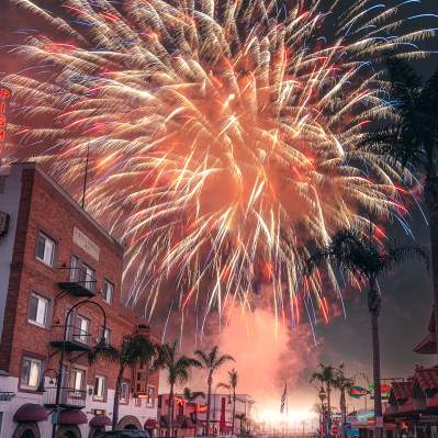fireworks in the sky above a street in Pismo Beach