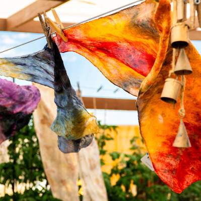 Hand dyed scarves drying in the wind