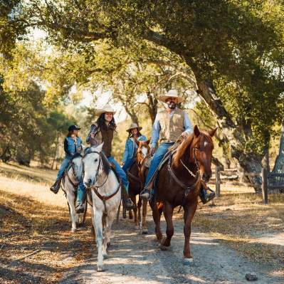 group horseback riding on a trail in Santa Margarita