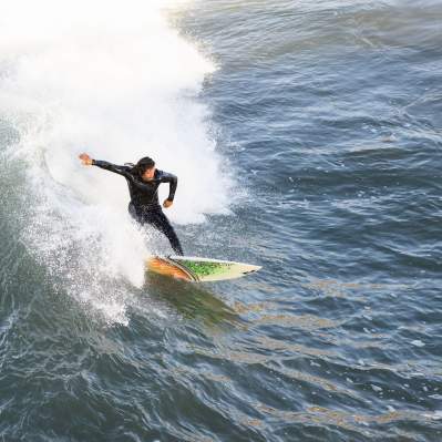 surfer surfing at pismo beach