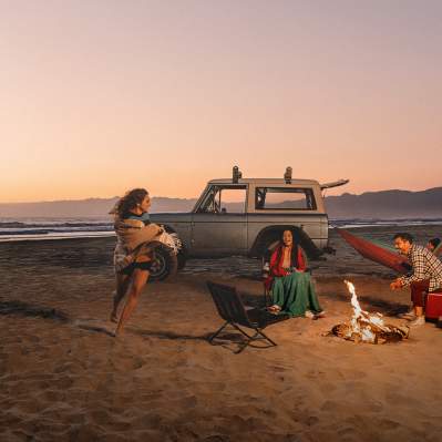 friends having a beach bonfire in Pismo