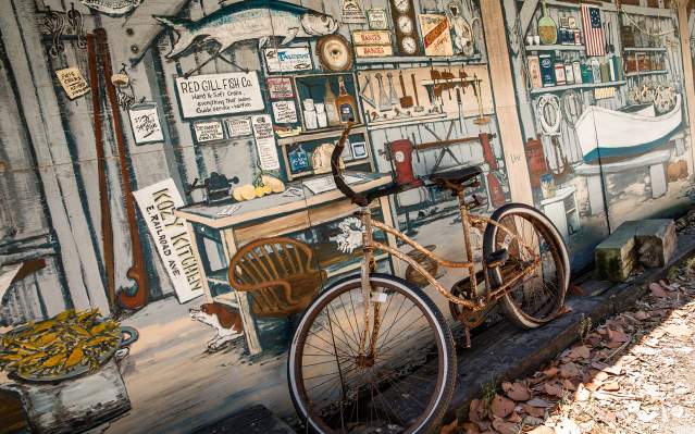 Vintage bicycle against a mural on Gasparilla Island, Florida