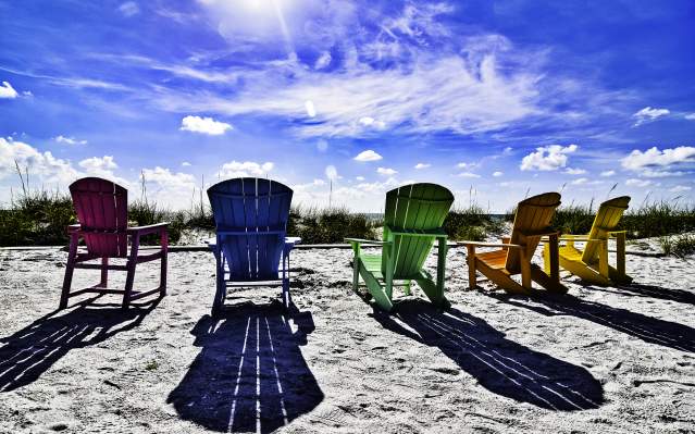 Paradise Awaiting Participants: Colorful Adirondak Chairs in the Sand