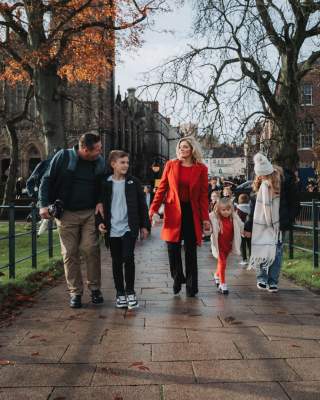 Family strolling through a park in County Armagh on a dull day.