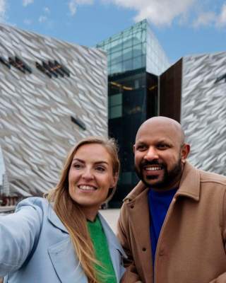 Couple taking a selfie in front of Titanic Belfast