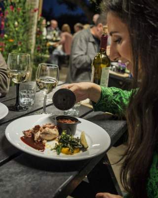 Couple enjoying a meal and a glass of wine at Slemish Supper Club, Ballymena