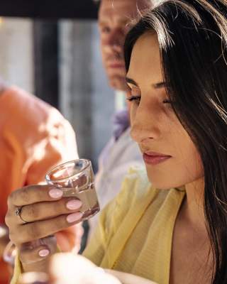 Group taste a cacao shot as part of the Master Craft Chocolate Experience