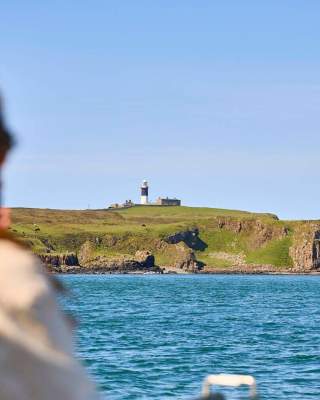 woman looking out over water