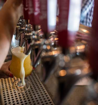 Pouring craft beer from the tap at Weyerbacher Brewing in Easton, PA