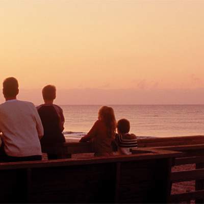 Family watching the sun set