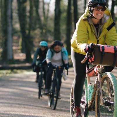 Group cycling along pathway in the New Forest