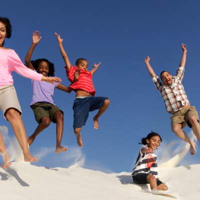 A family has some fun at White Sands National Monument.