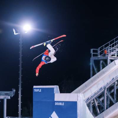 Freestyle skier performing in summer at night at Utah Olympic Park