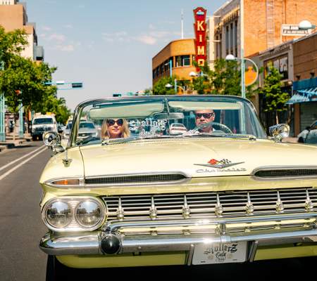 A lowrider drives down Central Avenue in Albuquerque.