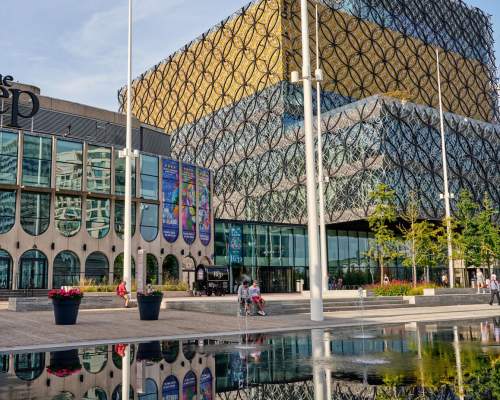 Outside of Birmingham Repertory Theatre; a glazed exterior with large lettering above saying 'the Rep'.