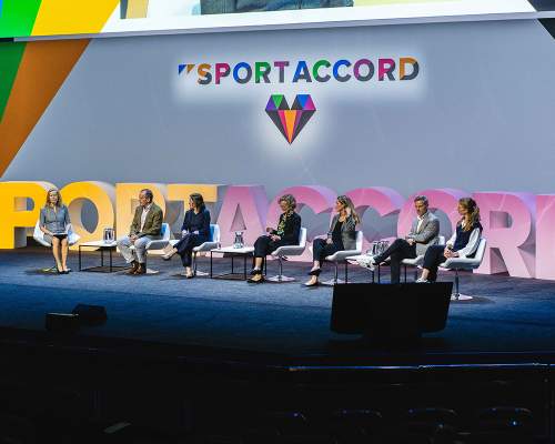 Conference speakers on a stage