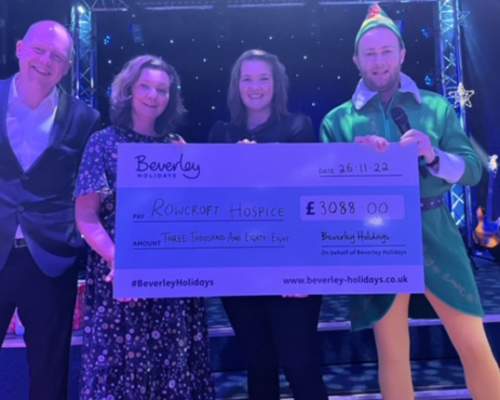 image shows team from beverley holidays with cheque