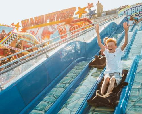 Children going down slides at Bridlington Funfair