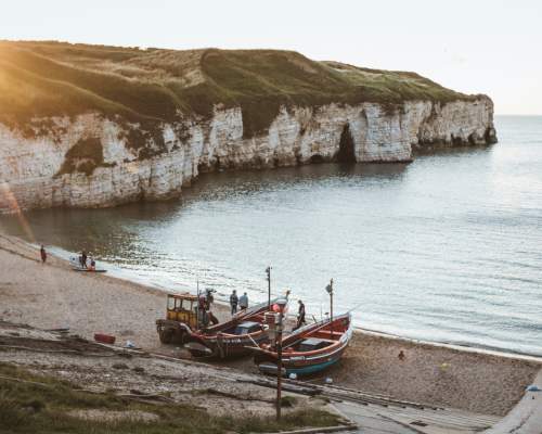 The sun sets over the beach at Flamborough North Landing in East Yorkshire