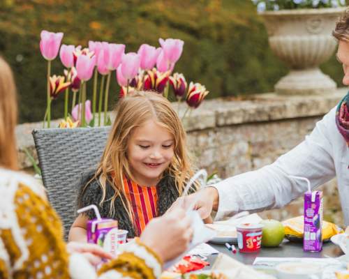 A family of three enjoying lunch at Sledmere House in East Yorkshire