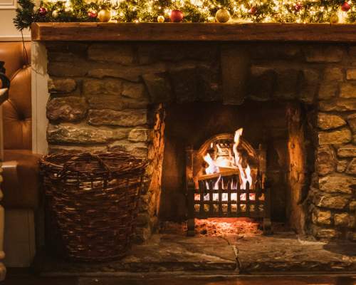 Diners enjoying the real fire at The Triton Inn in Brantingham, East Yorshire
