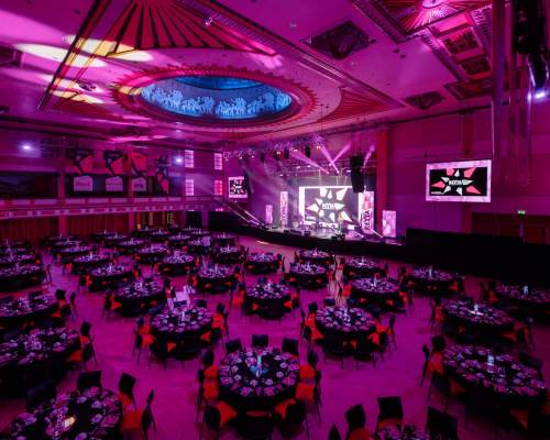 A shot of the REYTAs ceremony room, including tables, lighting and stage