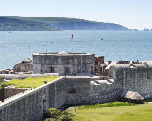 Exterior of Hurst Castle with the Isle of Wight and The Needles in the background in the New Forest