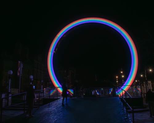 Image shows ARC installation from Lightport - a 10ft rainbow archway on Lord Street