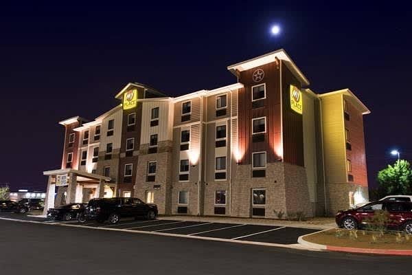 exterior shot of my place hotel entrance. red, yellow and beige