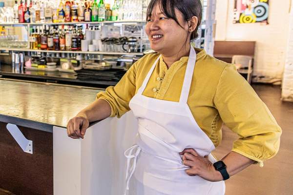 chef ji hye kim stands inside of Miss Kim