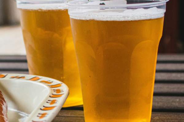 Two plastic cups of beer