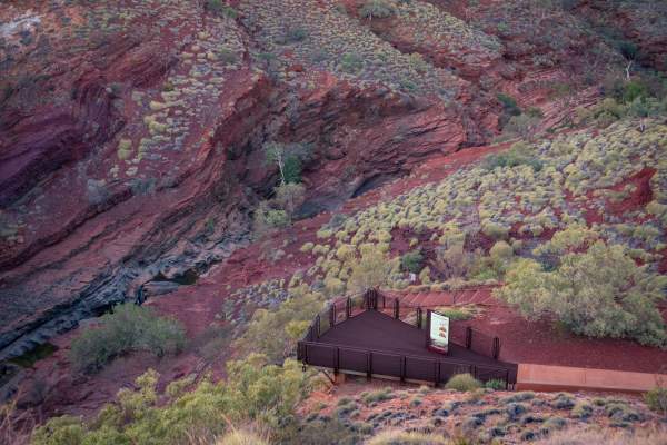 View of a lookout area at Hamersley Gorge with it's distinctive banded rock in the background