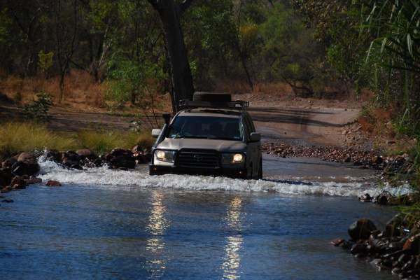 Venture North Safaris tour vehicle on a water crossing