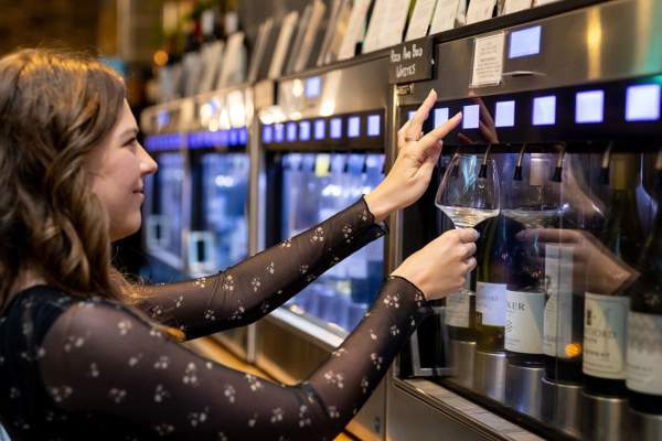 Woman choosing wine from Enomatic machine at Le Vignoble Bristol - credit Le Vignoble