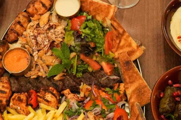 Platter of food, hummus and stuffed vine leaves from Lamaya