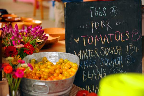 Sign with offerings at the Eno River Farmers' Market