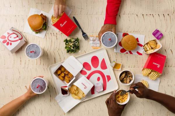 Friends sharing food at a Chick-fil-A