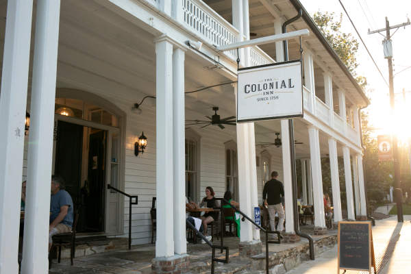 People Gathering on the Porch at The Colonial Inn, Hillsborough