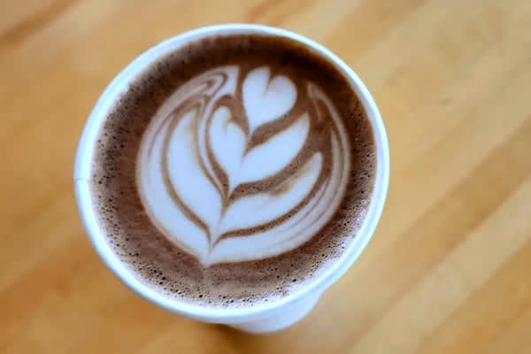 Cup of espresso with heart flower swirl design from Gray Squirrel.