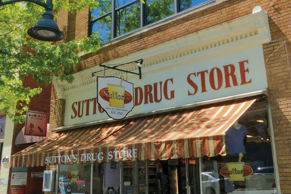 Outside sign of Sutton's Drug Store on Franklin Street