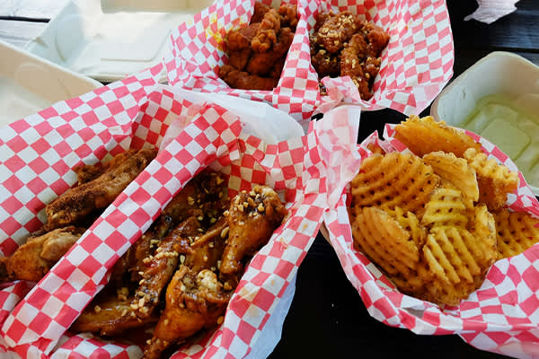 Basket of french fries and chicken wings from Heavenly Buffaloes