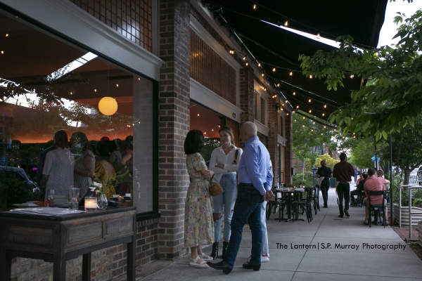 Group of People Talking Outside of Lantern Restaurant