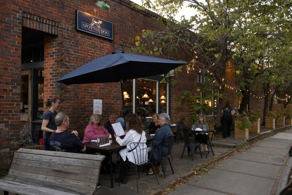 People dining outside at the Spotted Dog Restaurant